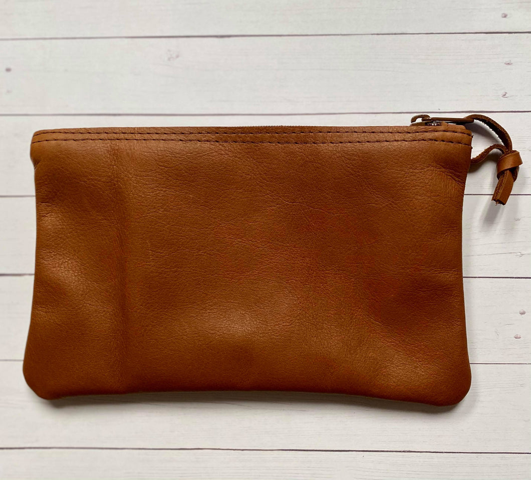 Brown leather clutch